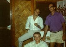 George, bank manager at Kieta, sitting, behind him John and David